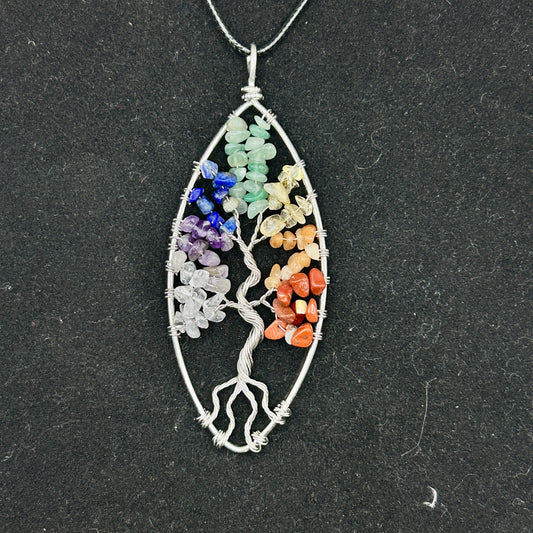 Chakra Tree Of Life Pendant on a black cord necklace